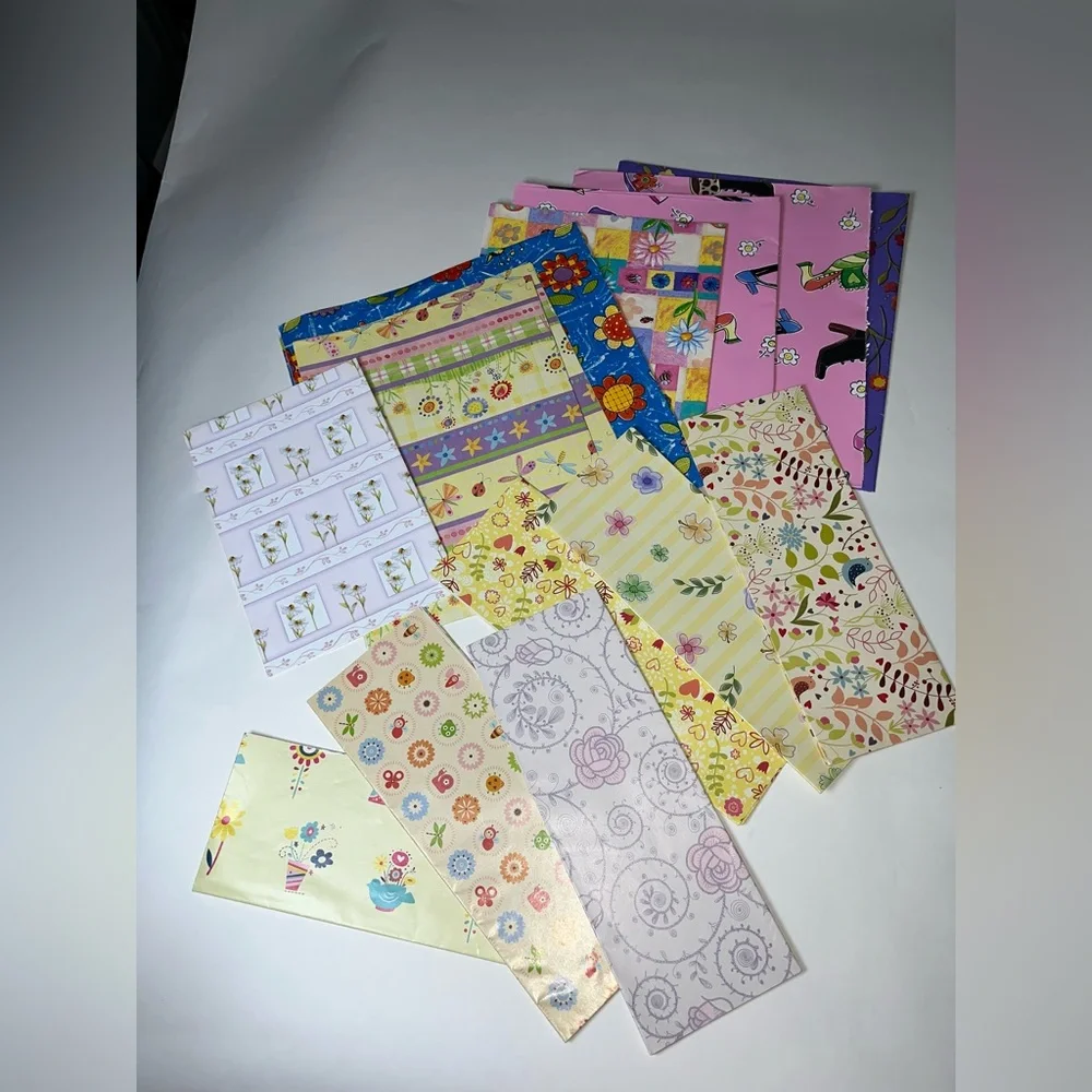 NWOT 15 sheets of flowered wrapping paper. Most sheets are 20” x 30”, at a min